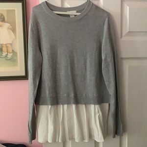 Women’s sweater with white shirt below